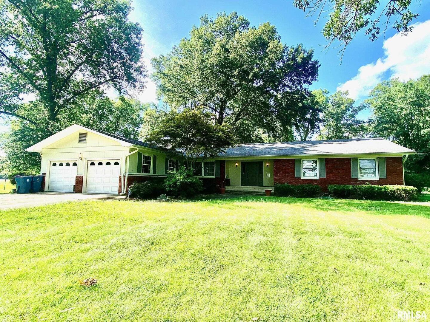 807 West Market Street Christopher, IL 62822 - Photo 37 of 57 a front view of a house with a yard and trees