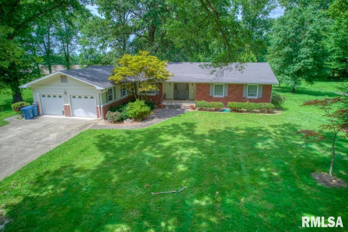 807 West Market Street Christopher, IL 62822 - Photo 42 of 57 a front view of a house with a garden