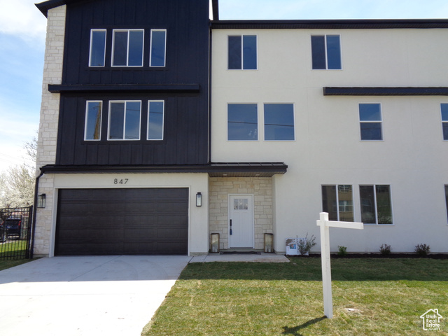 851 West Center Street Midvale, UT 84047 - Photo 1 of 1 View of front of home featuring stone siding, board and batten siding, concrete driveway, and an attached garage