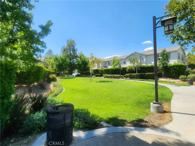 a view of a fountain in front of a house