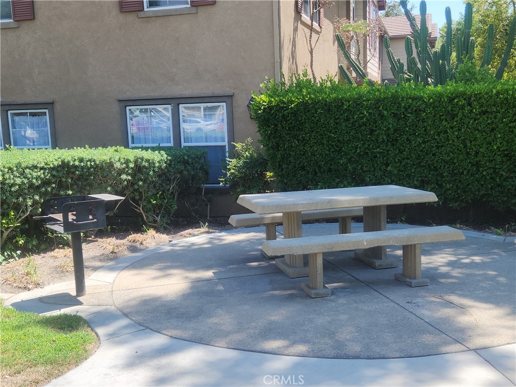 7331 Shelby Place, Unit U43 Rancho Cucamonga, CA 91739 - Photo 24 of 26 a view of a patio with a bench and plants