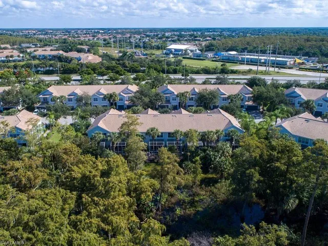 an aerial view of a residential houses and outdoor space