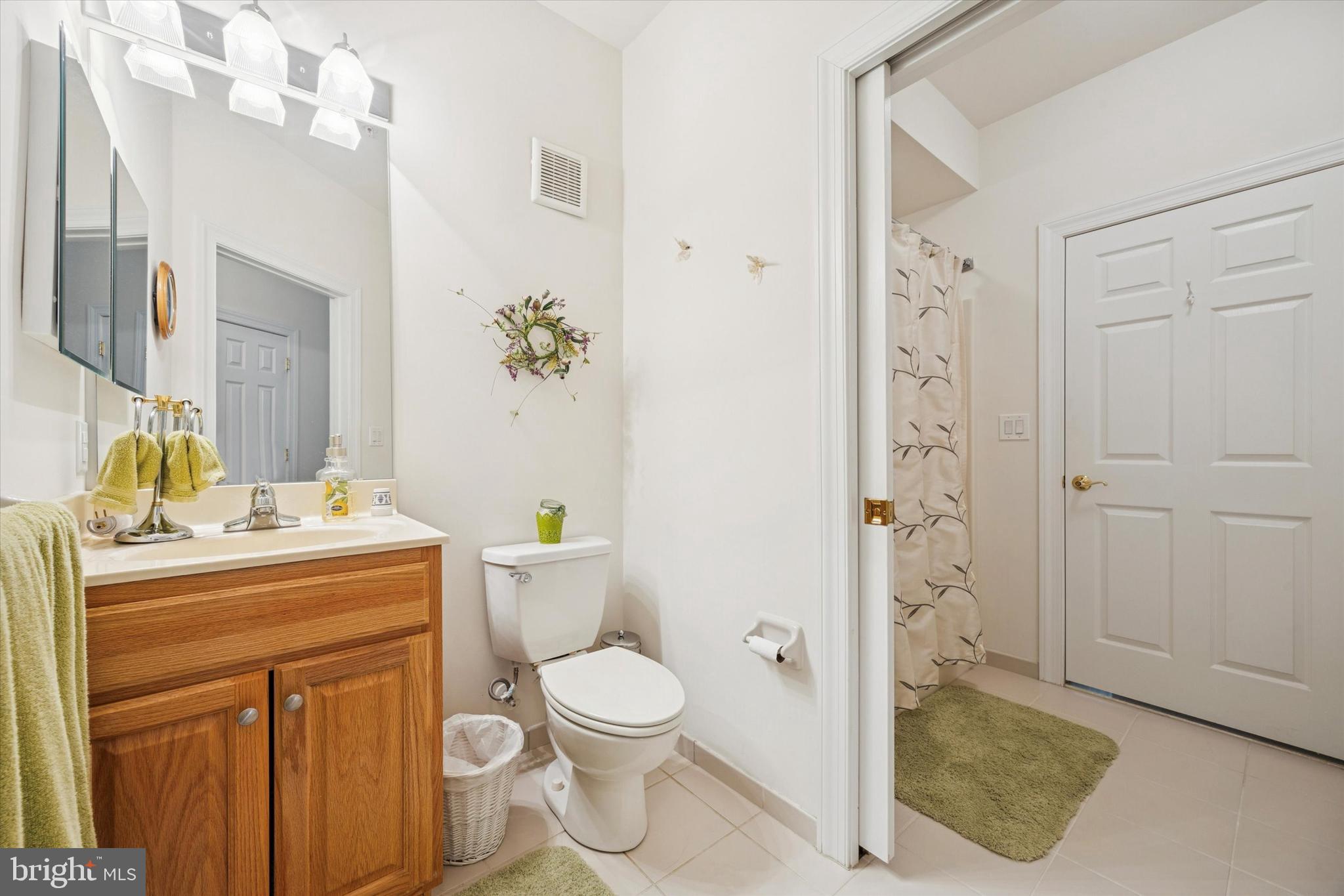 3000 Village Way, Unit 3101 Boothwyn, PA 19061 - Photo 12 of 29 a bathroom with a granite countertop sink toilet and shower