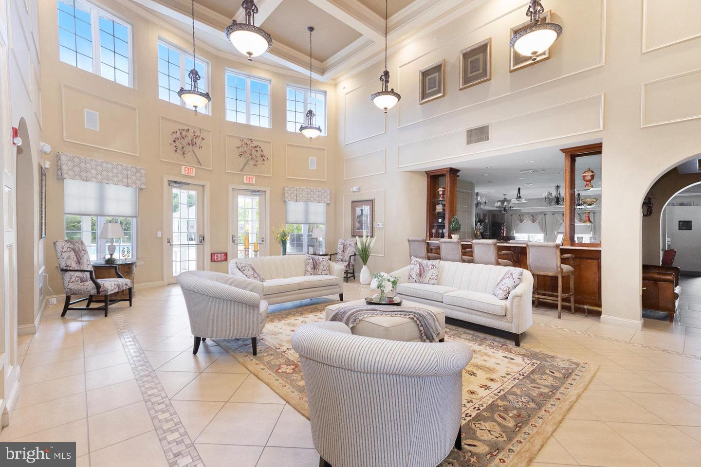3000 Village Way, Unit 3101 Boothwyn, PA 19061 - Photo 17 of 29 a living room with fireplace furniture and a rug