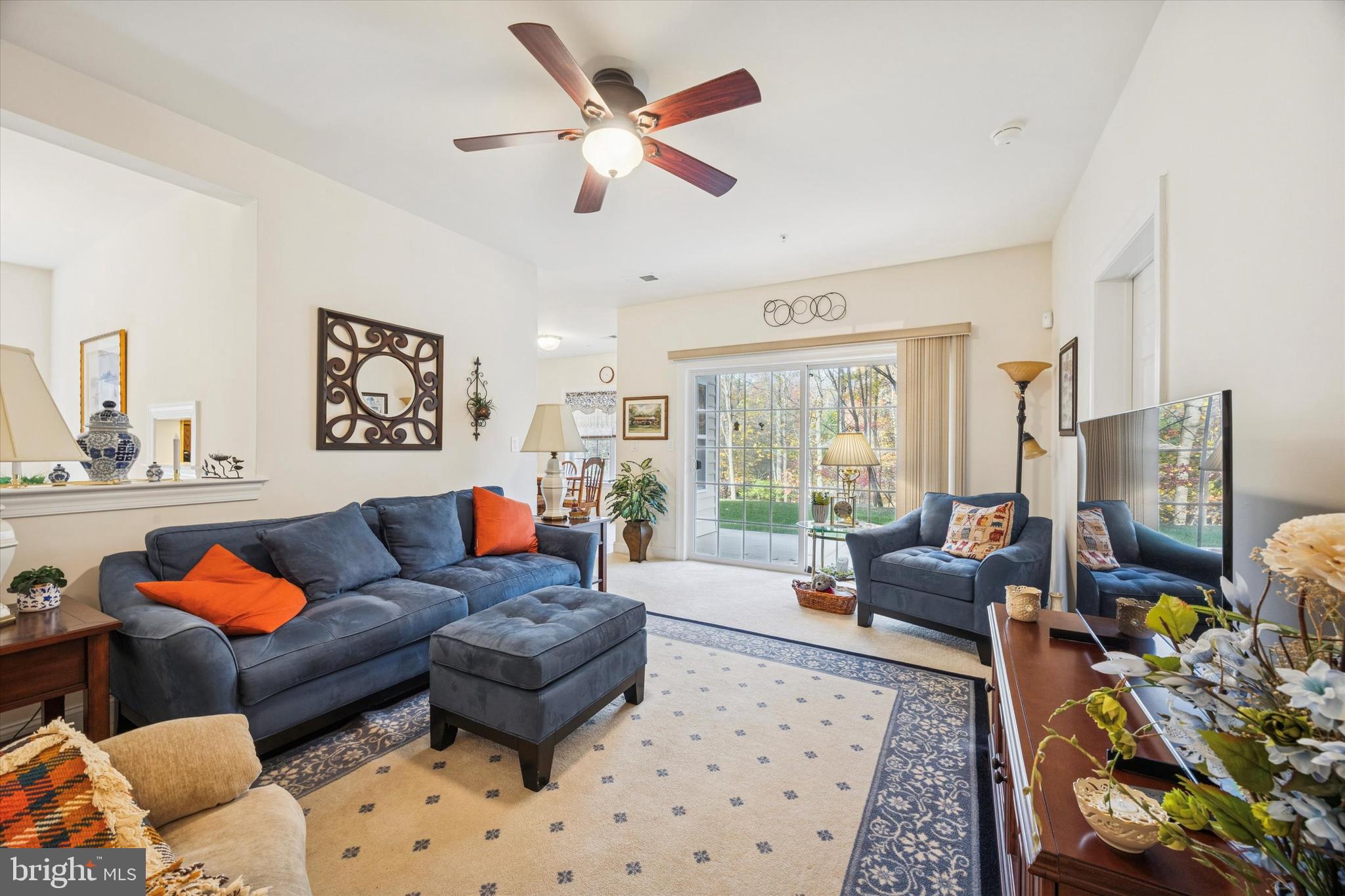 3000 Village Way, Unit 3101 Boothwyn, PA 19061 - Photo 3 of 29 a living room with furniture ceiling fan and a rug