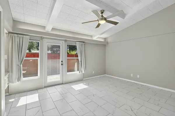 a view of an empty room with a window