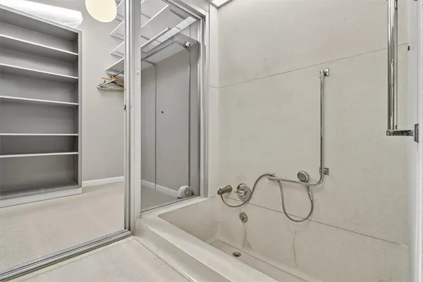 a bathroom with a sink and a shower