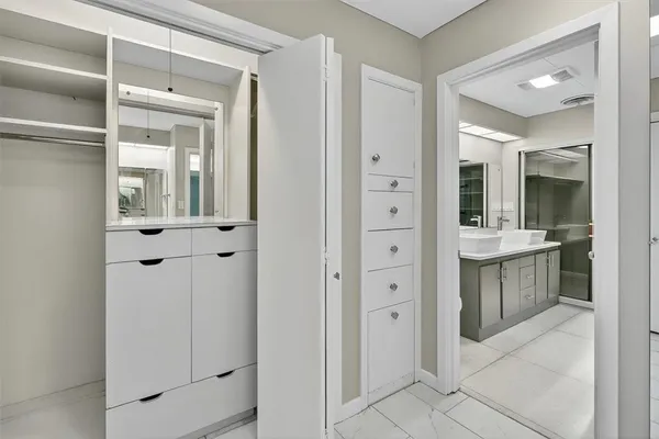 a bathroom with a shower and a sink