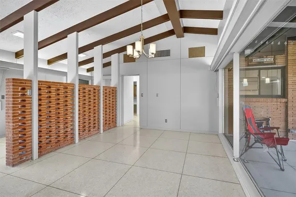 a view of a brick house with an outdoor space