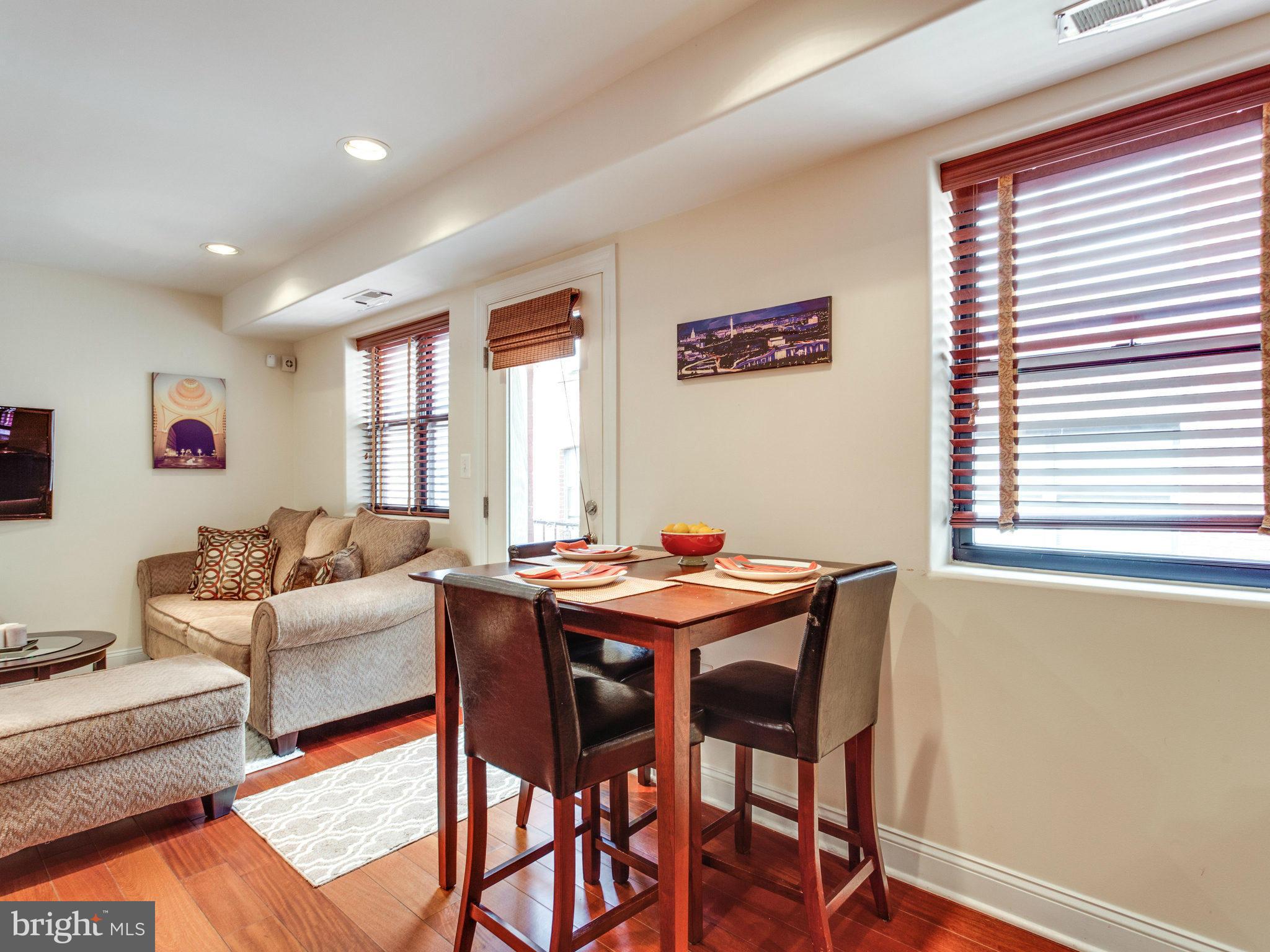 1354 Euclid Street Northwest, Unit B402 Washington, DC 20009 - Photo 12 of 30 a dining room with furniture and window