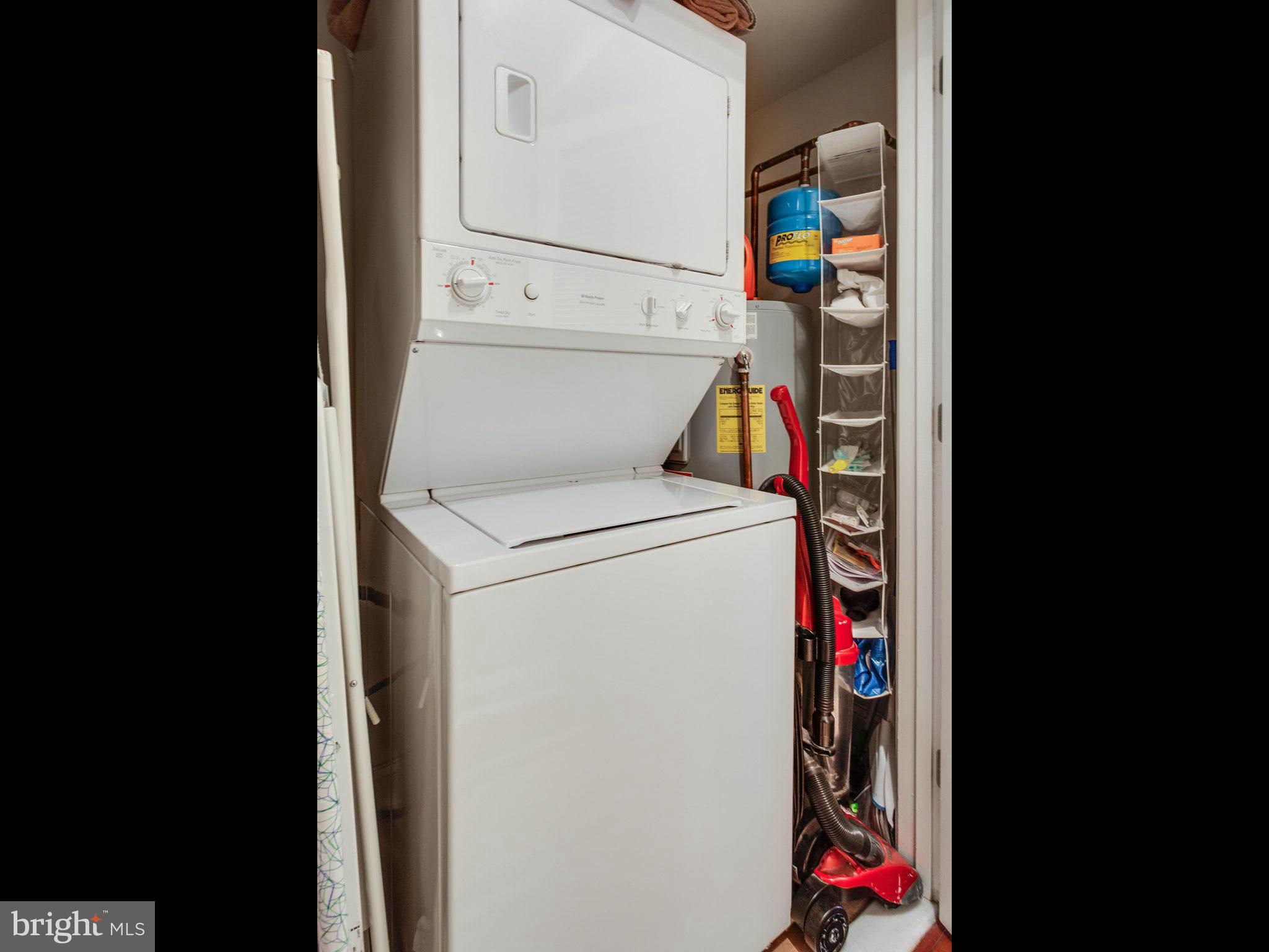 1354 Euclid Street Northwest, Unit B402 Washington, DC 20009 - Photo 21 of 30 a utility room with dryer and washer