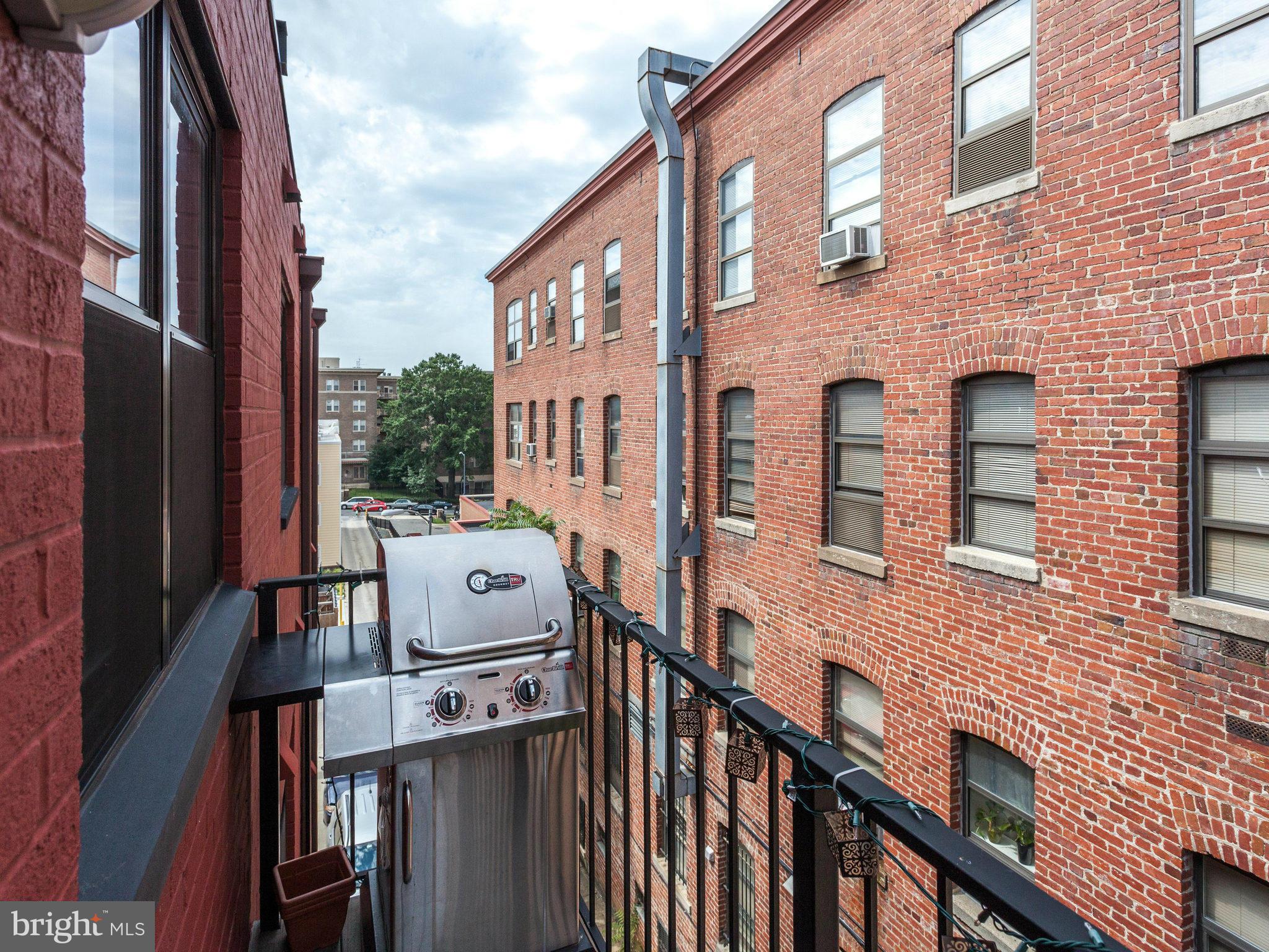 1354 Euclid Street Northwest, Unit B402 Washington, DC 20009 - Photo 22 of 30 a view of a brick buildings from a balcony