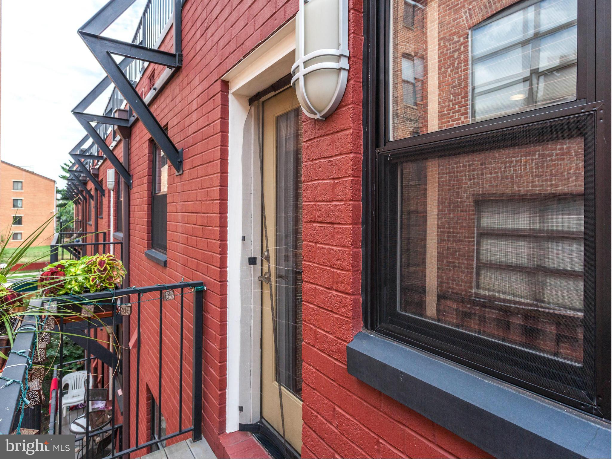 1354 Euclid Street Northwest, Unit B402 Washington, DC 20009 - Photo 23 of 30 a view of a door of the house and a street view