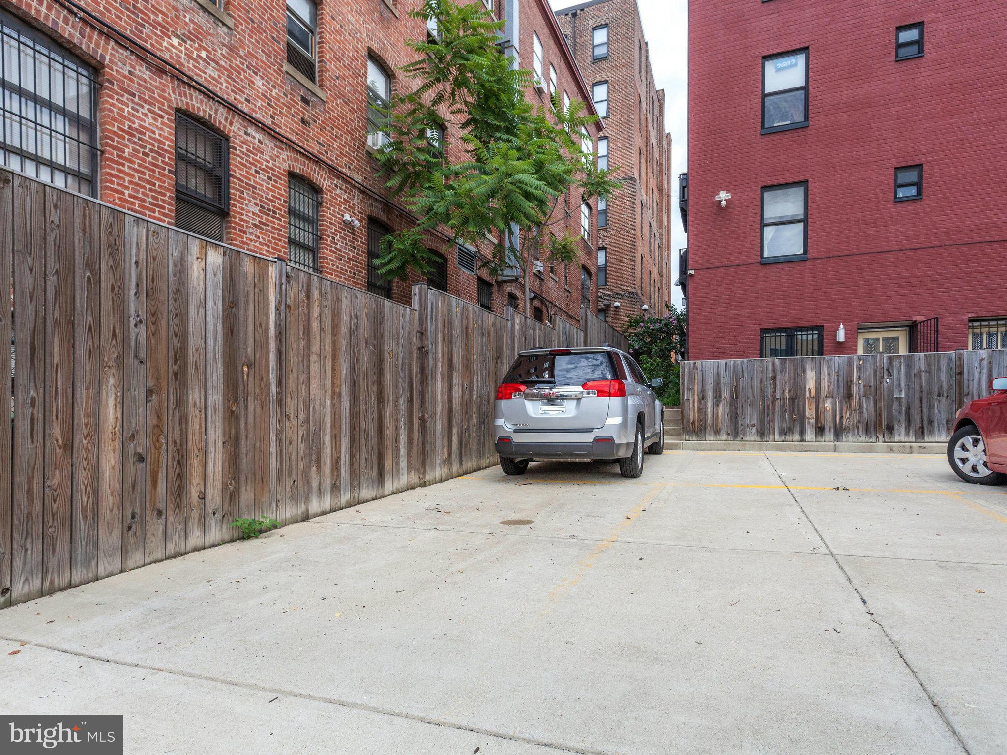 1354 Euclid Street Northwest, Unit B402 Washington, DC 20009 - Photo 25 of 30 a car parked in front of a building