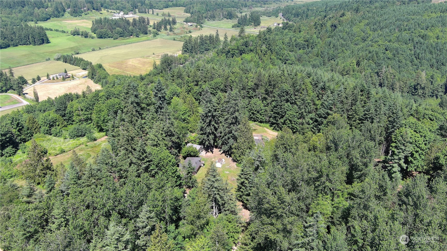 850 No Name Road Port Ludlow, WA 98365 - Photo 23 of 28 an aerial view of a houses with a yard and lake view