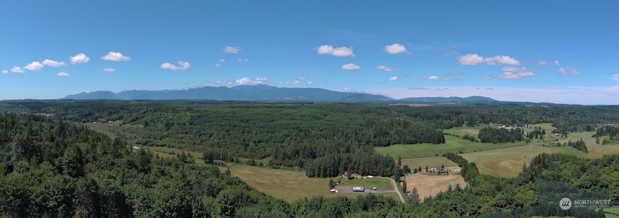 850 No Name Road Port Ludlow, WA 98365 - Photo 5 of 28 a view of a city with lush green forest