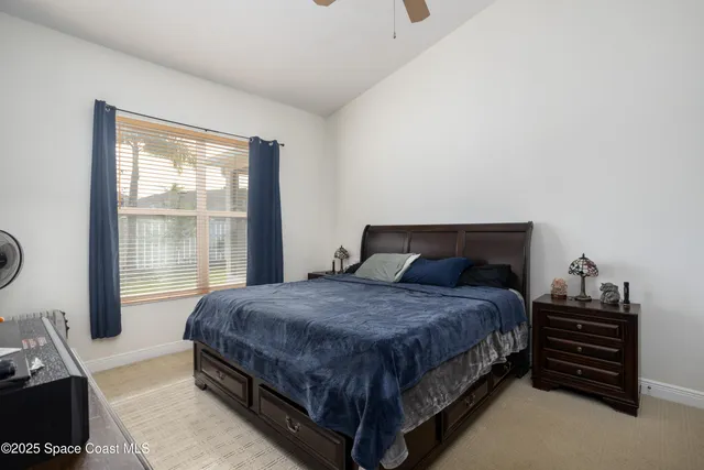 a bathroom with a granite countertop bathtub a sink and a large mirror