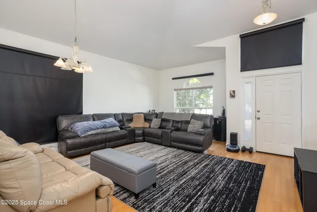 a living room with furniture and a couch