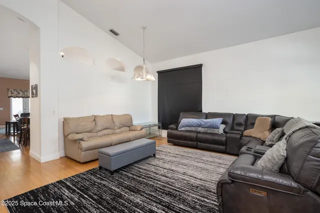 a living room with couches and a table