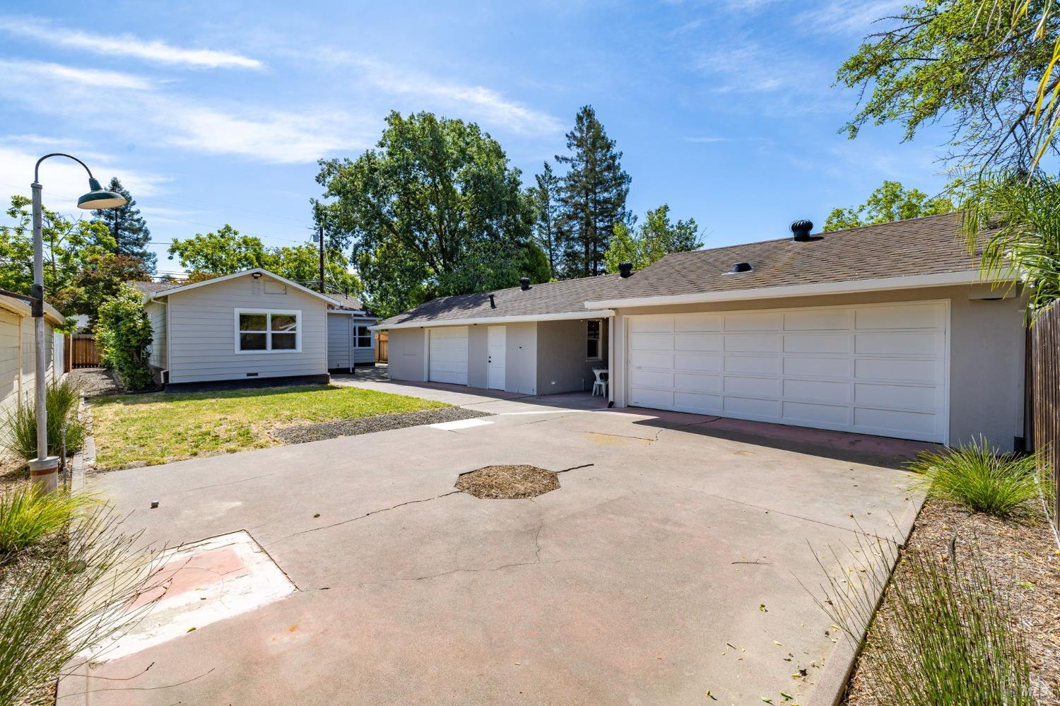 2211 Humboldt Street Santa Rosa, CA 95404 - Photo 44 of 52 a front view of a house with a yard and garage