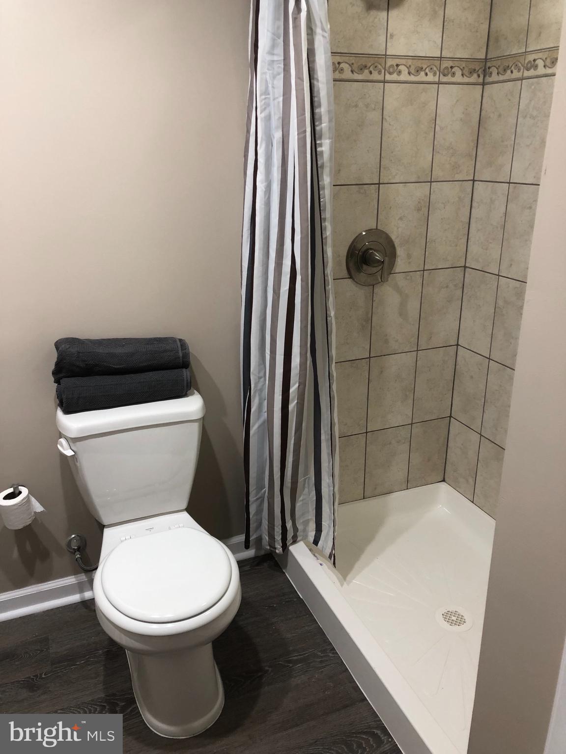 2233 Graythorn Road Middle River, MD 21220 - Photo 12 of 36 a white toilet sitting next to a bath tub