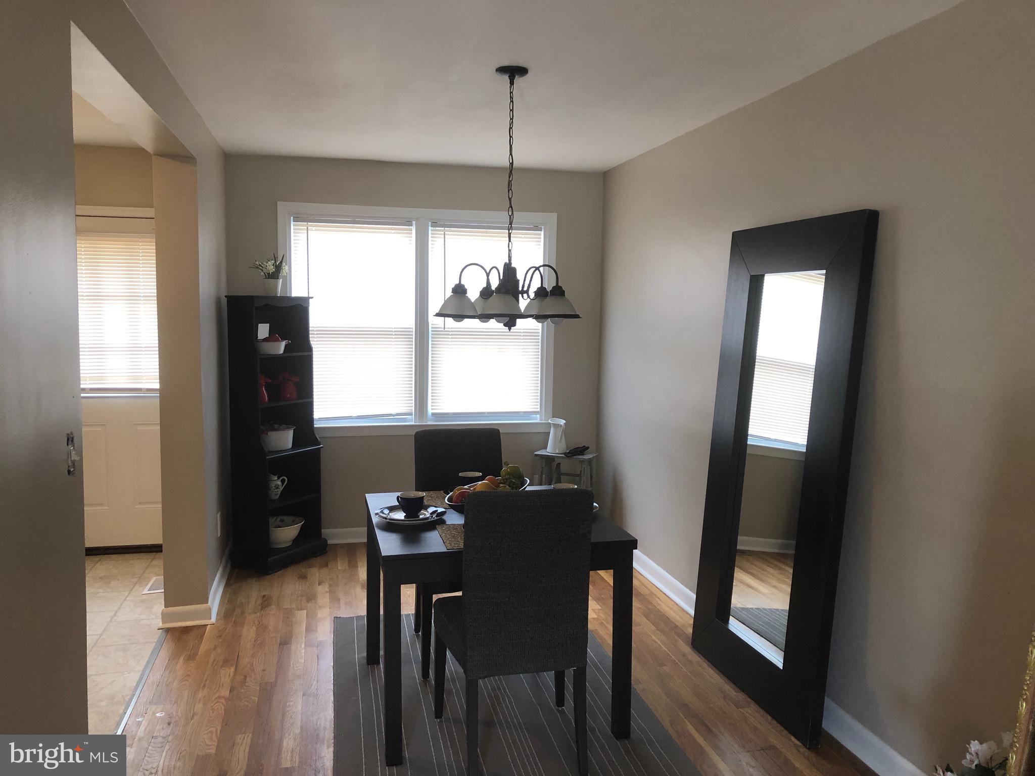 2233 Graythorn Road Middle River, MD 21220 - Photo 19 of 36 a view of a dining room with furniture window and wooden floor