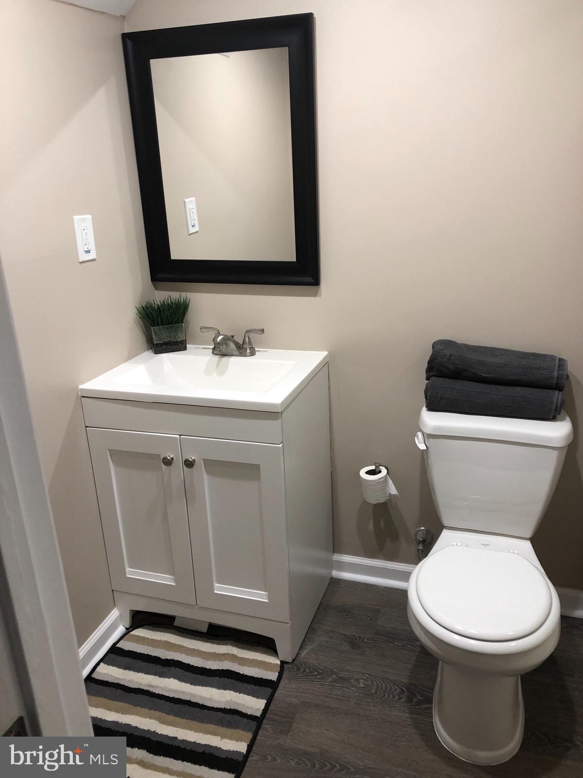 2233 Graythorn Road Middle River, MD 21220 - Photo 21 of 36 a bathroom with a toilet sink and mirror