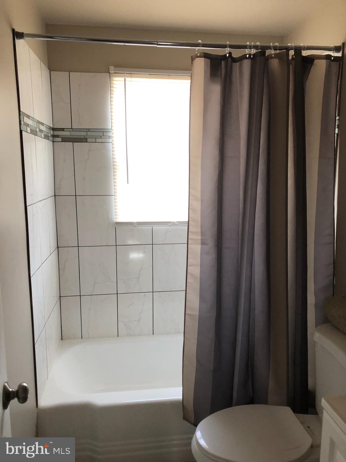 2233 Graythorn Road Middle River, MD 21220 - Photo 23 of 36 a bathroom with a shower a toilet and sink