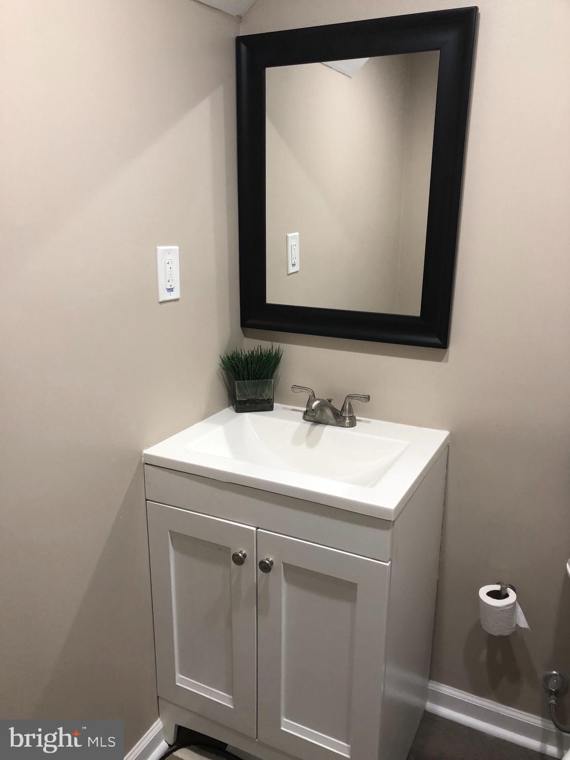 2233 Graythorn Road Middle River, MD 21220 - Photo 29 of 36 a bathroom with a sink a mirror and a toilet