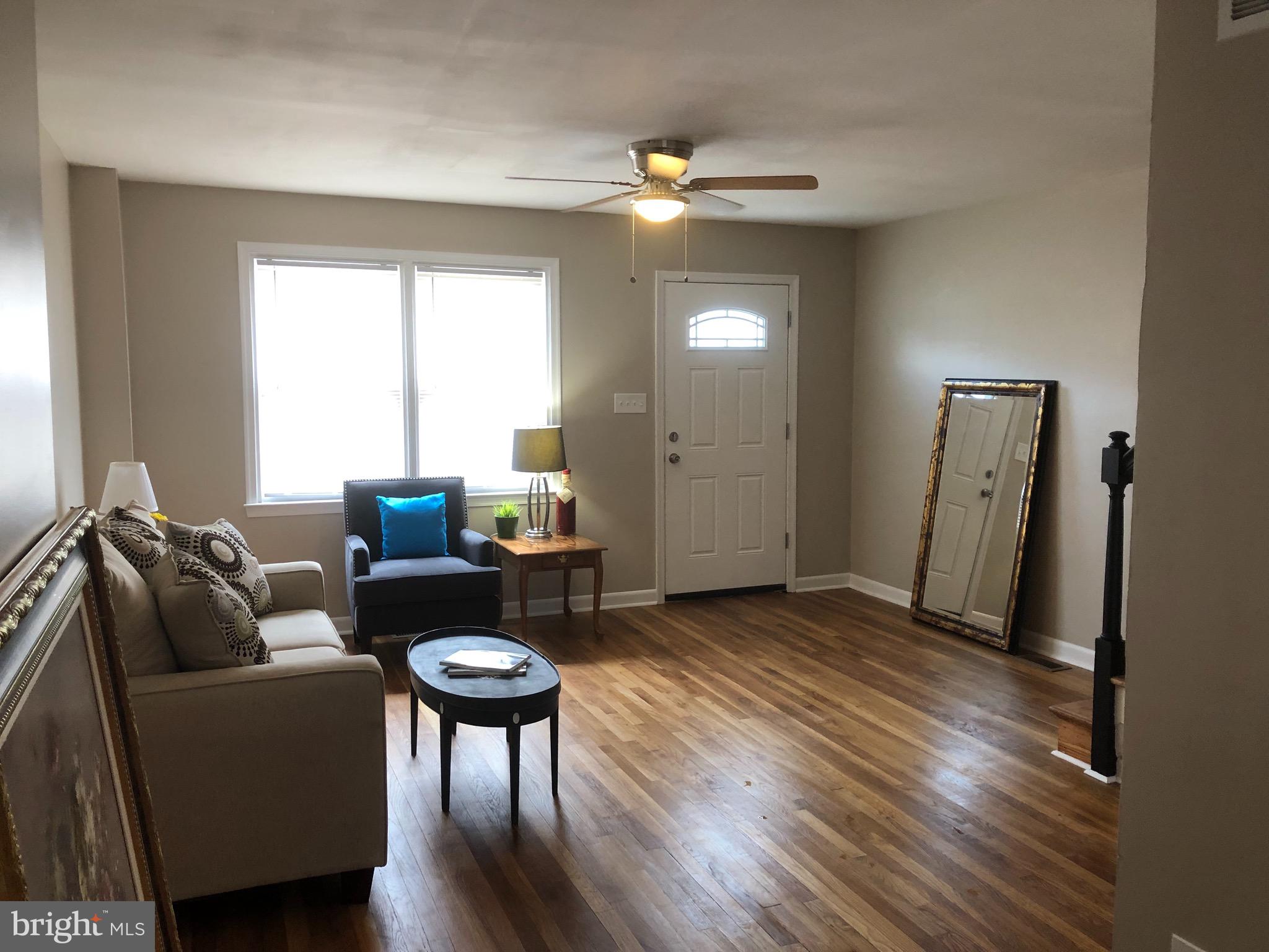 2233 Graythorn Road Middle River, MD 21220 - Photo 31 of 36 a living room with furniture and a wooden floor