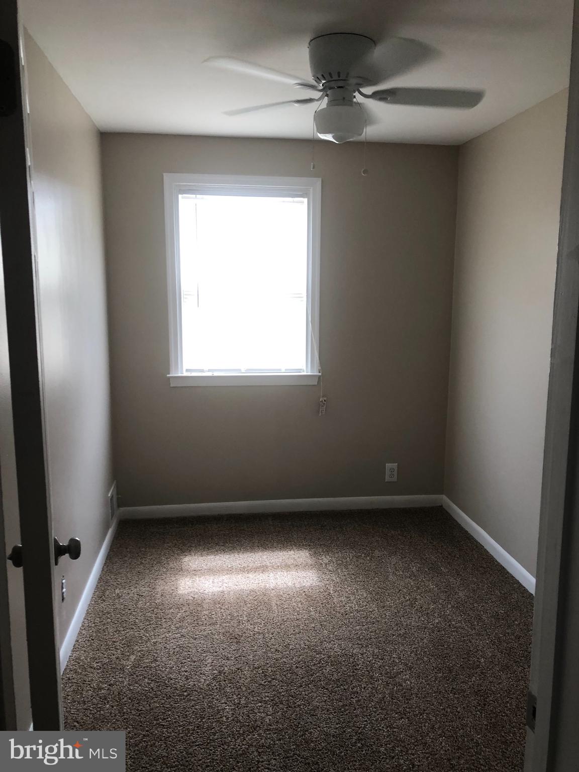 2233 Graythorn Road Middle River, MD 21220 - Photo 35 of 36 an empty room with a window and a fan