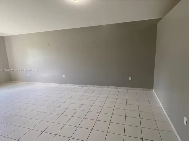 an empty room with white walls