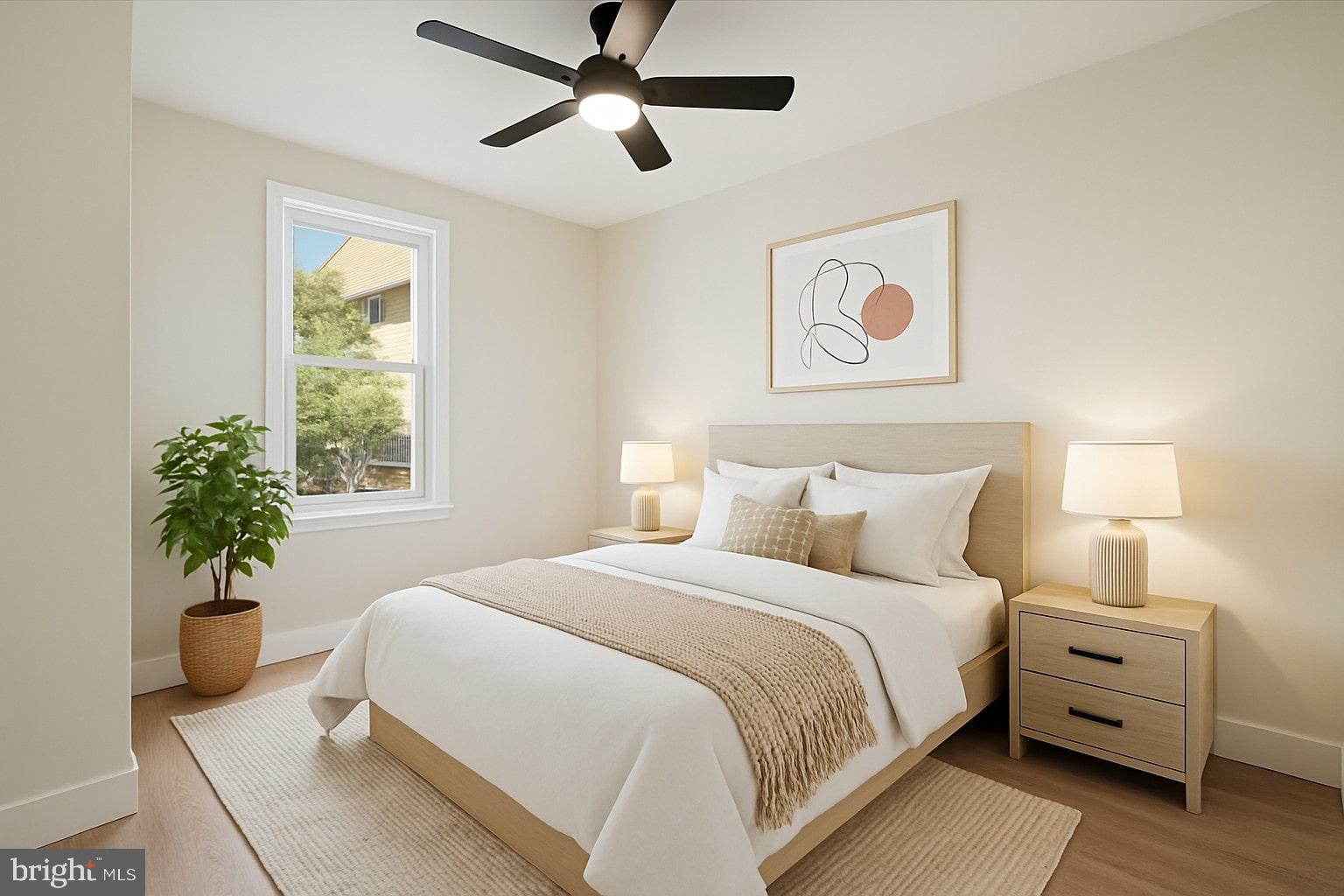 a bedroom with a bed and a potted plant