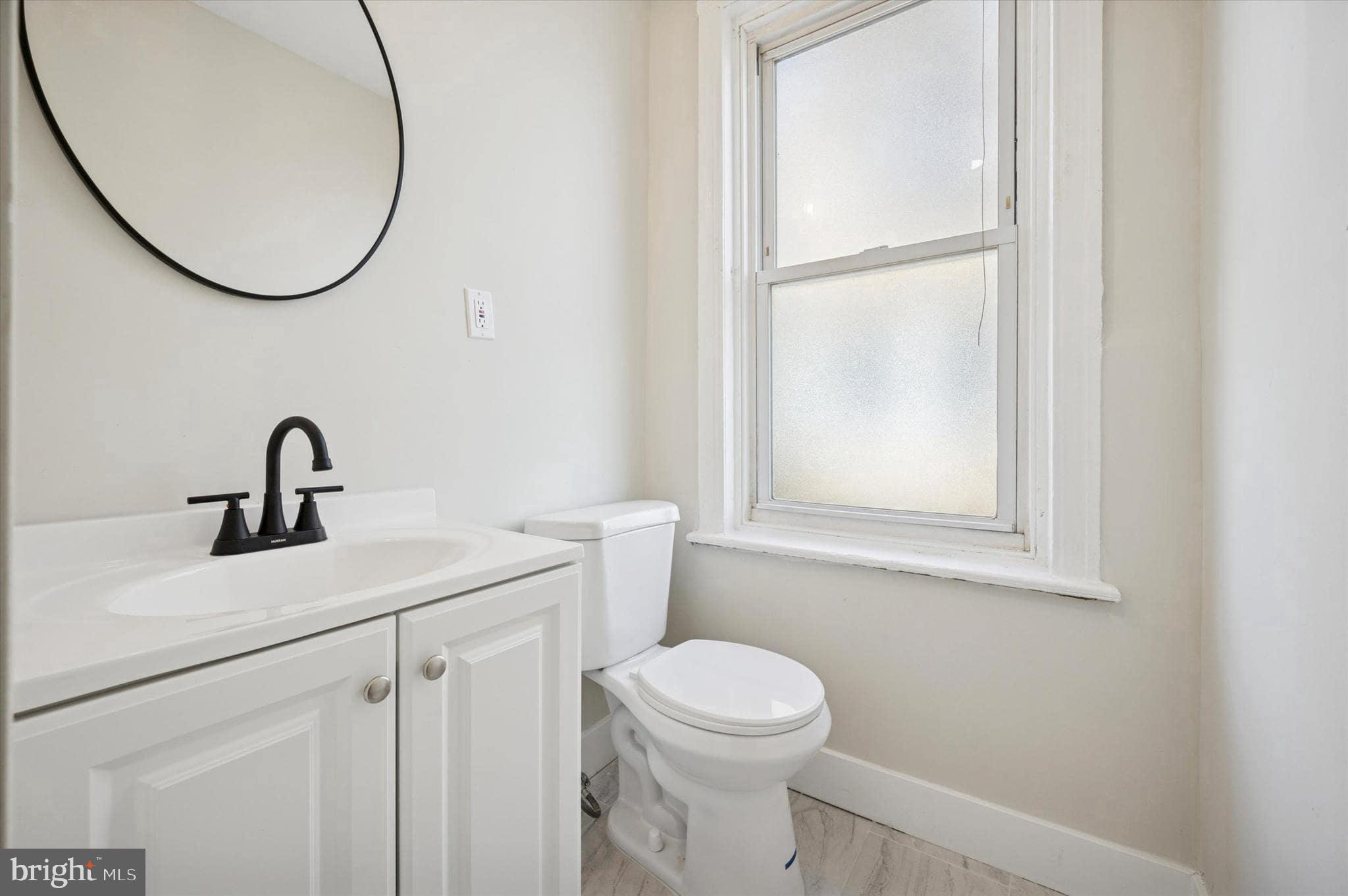 75 High Street Philadelphia, PA 19144 - Photo 12 of 20 a bathroom with a sink and a mirror