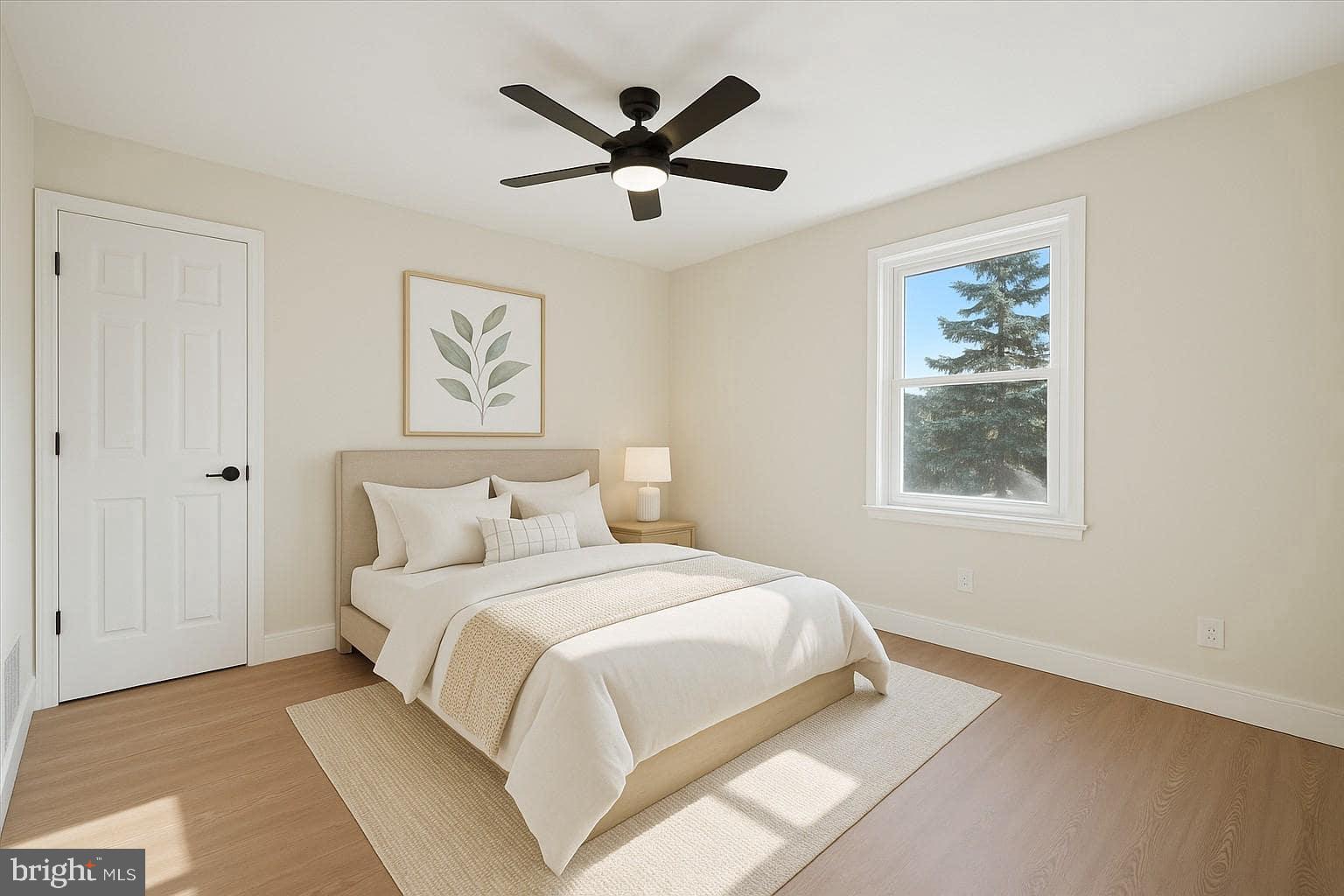 75 High Street Philadelphia, PA 19144 - Photo 14 of 20 a bedroom with a large bed and a window