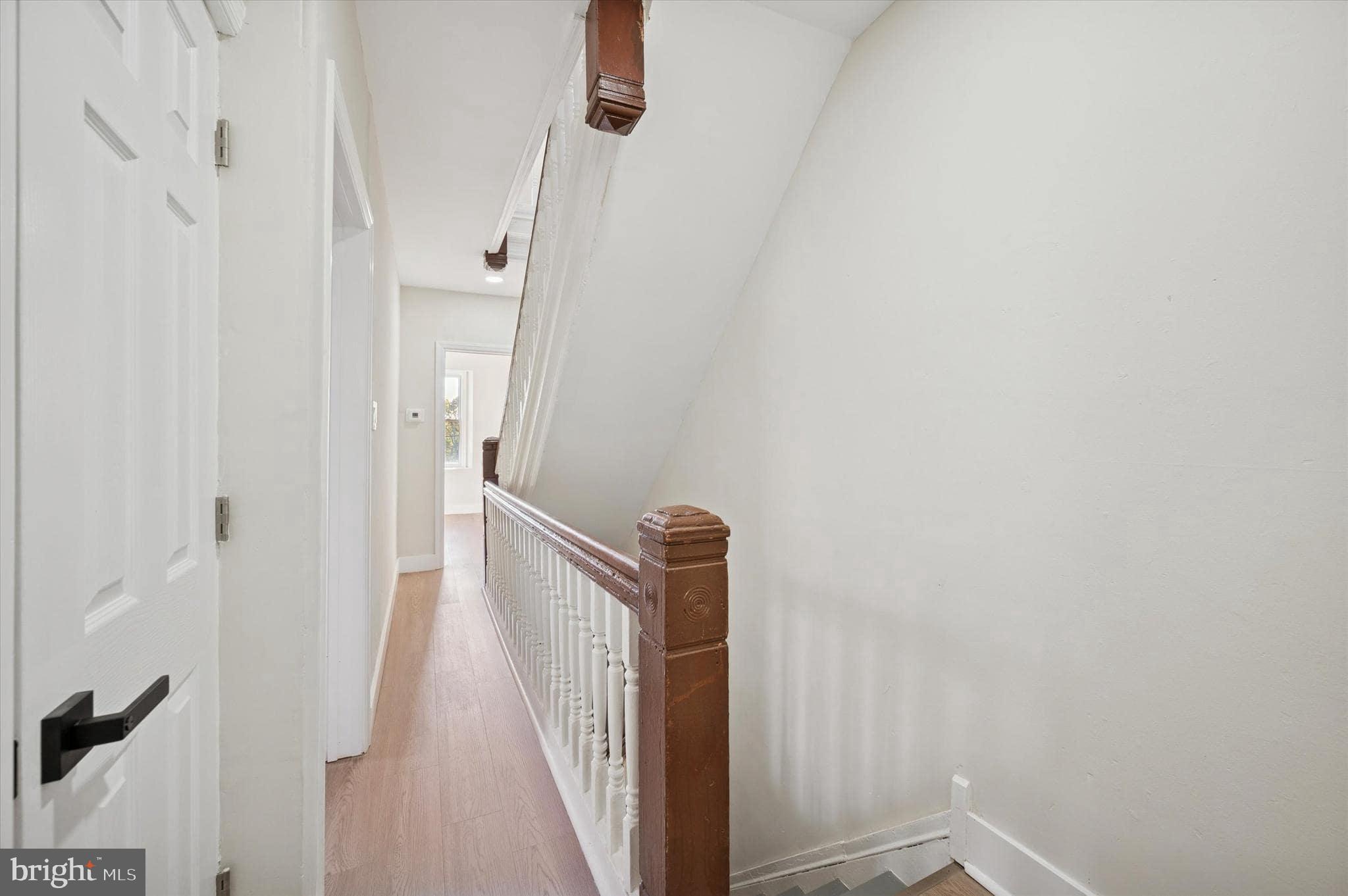 75 High Street Philadelphia, PA 19144 - Photo 15 of 20 a view of a hallway with a white walls and stairs