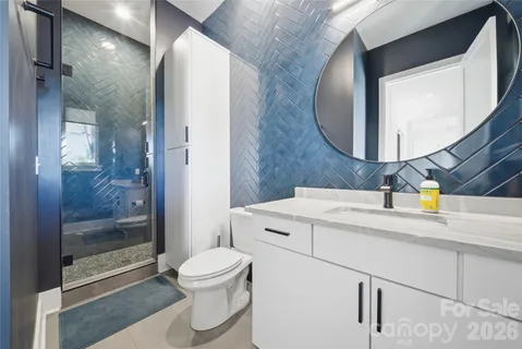 a spacious bathroom with a double vanity sink and a mirror