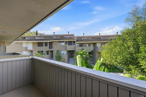 aerial view of a house with a yard