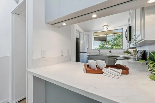 a room with a large bed and a window