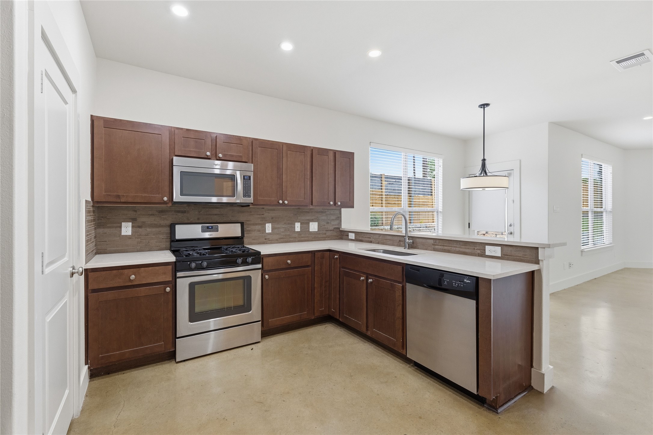 4124 Valley View Road, Unit 4A & 4B Austin, TX 78704 - Photo 7 of 40 Modern kitchen with stainless steel appliances and a convenient breakfast bar.