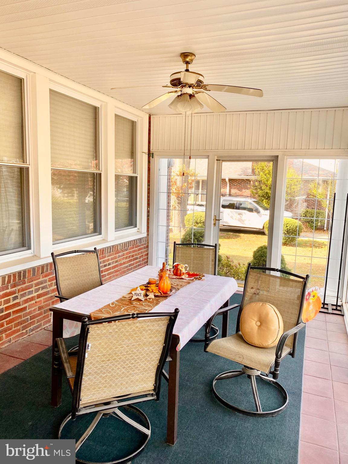 420 Heulings Avenue, Unit 2S Riverside, NJ 08075 - Photo 3 of 11 a dining room with furniture a chandelier and wooden floor