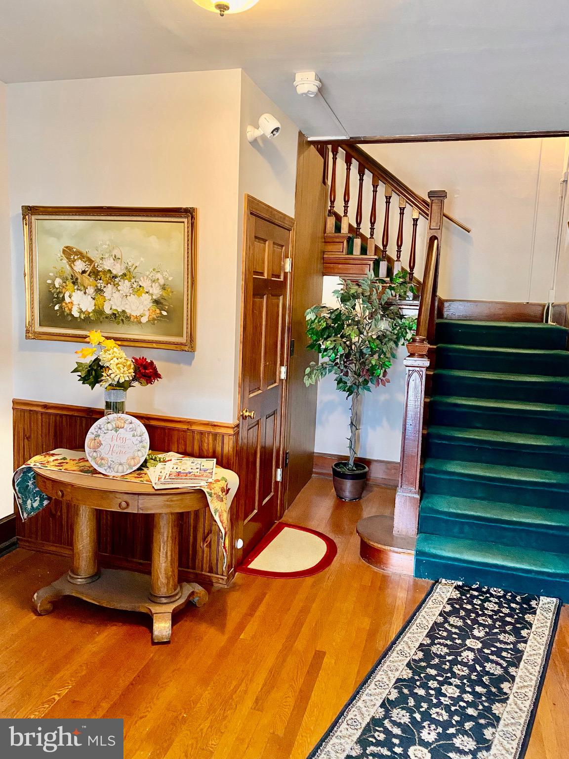 420 Heulings Avenue, Unit 2S Riverside, NJ 08075 - Photo 4 of 11 a dining room with furniture and a rug