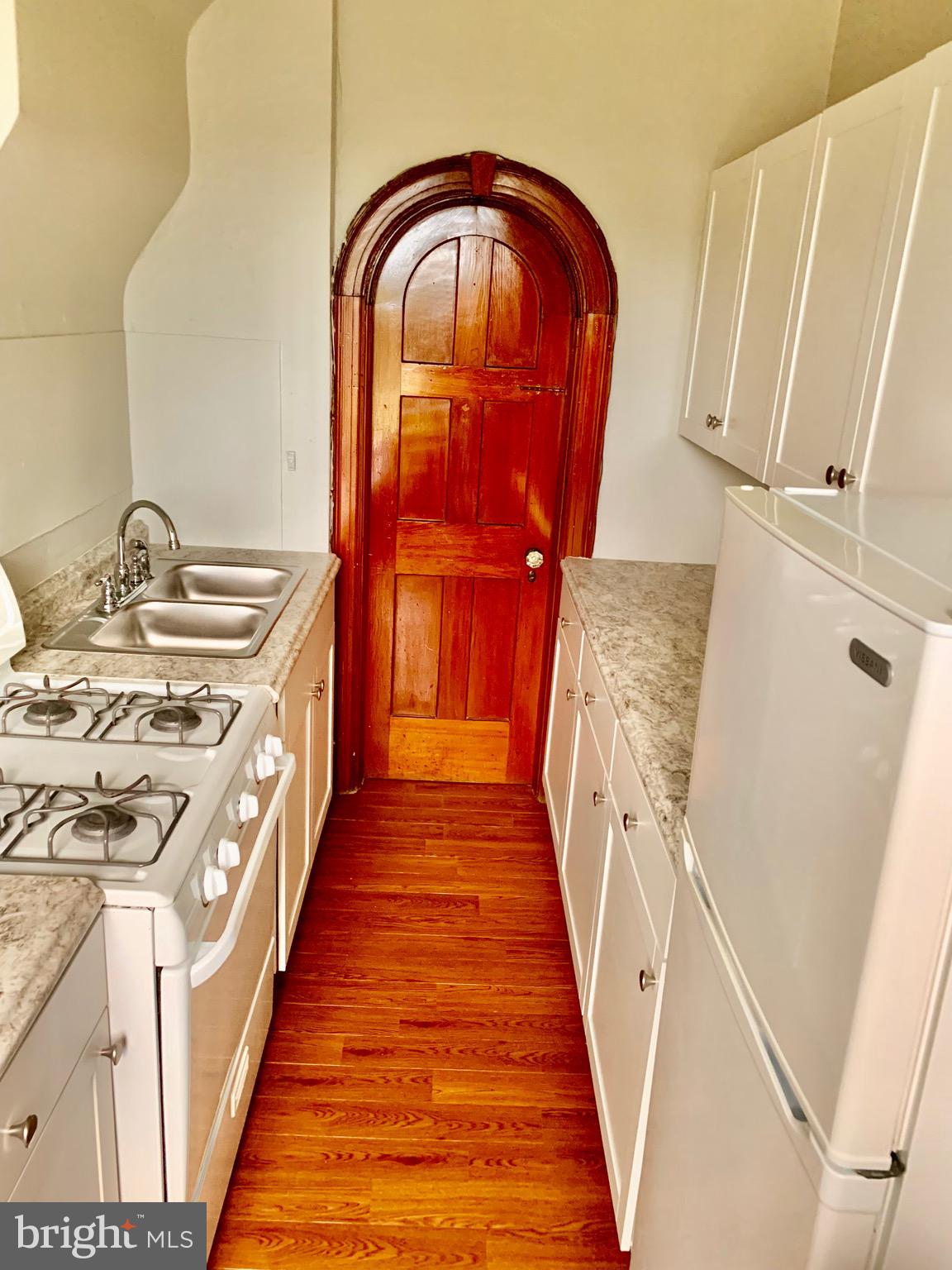 420 Heulings Avenue, Unit 2S Riverside, NJ 08075 - Photo 7 of 11 a view of a hallway with wooden floor