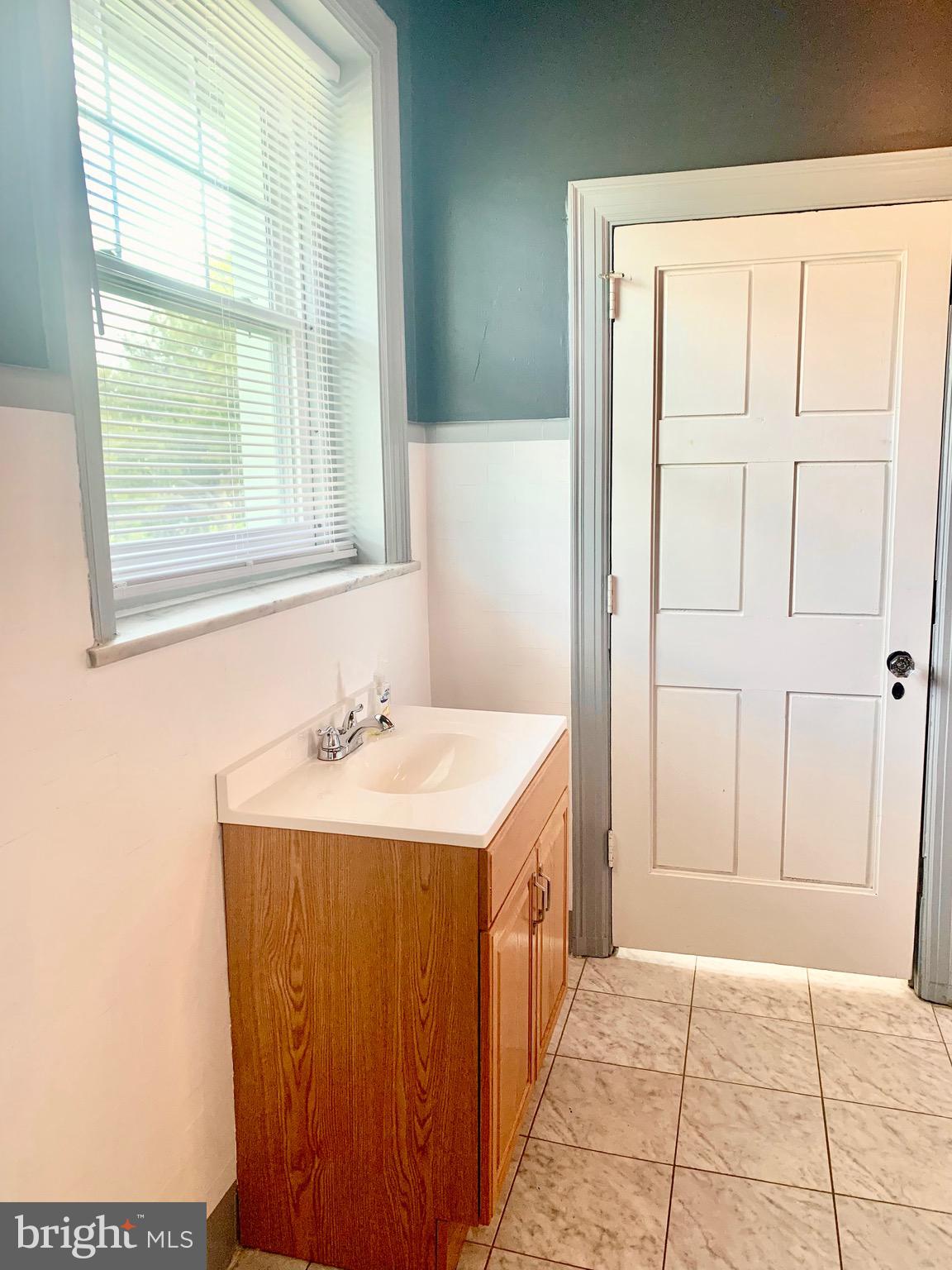 420 Heulings Avenue, Unit 2S Riverside, NJ 08075 - Photo 8 of 11 a bathroom with a sink and a bathtub