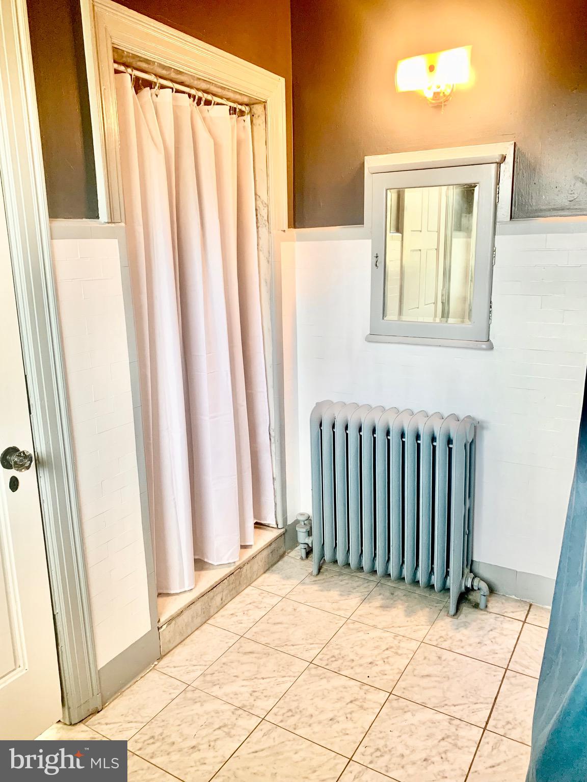 420 Heulings Avenue, Unit 2S Riverside, NJ 08075 - Photo 9 of 11 a view of a bedroom with wooden floor and a window