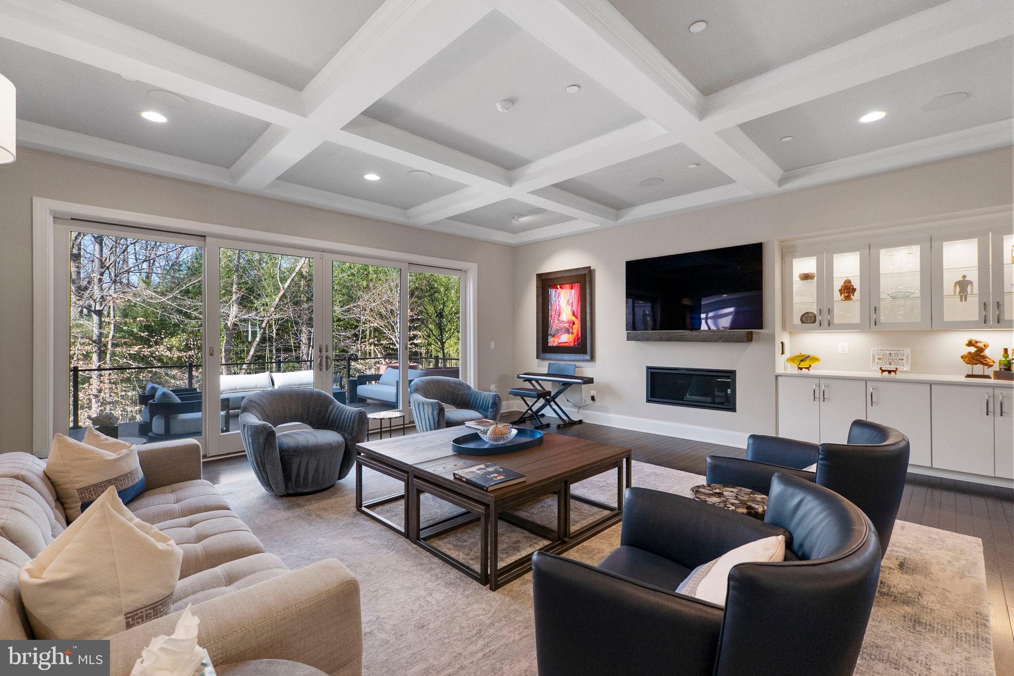 11760 Glen Mill Road Potomac, MD 20854 - Photo 12 of 64 a living room with furniture a flat screen tv and a large window