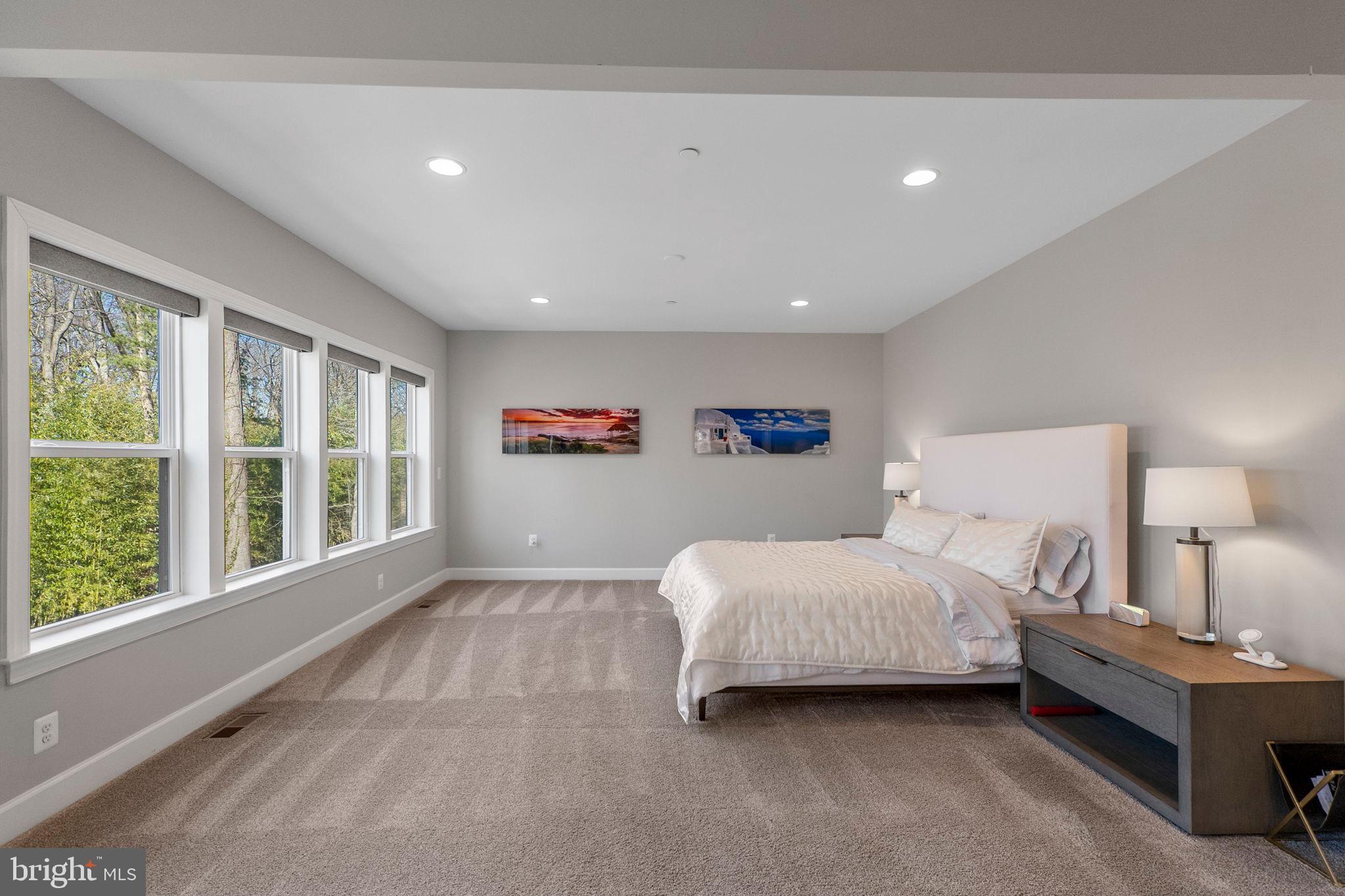 11760 Glen Mill Road Potomac, MD 20854 - Photo 27 of 64 a spacious bedroom with a bed and a large window