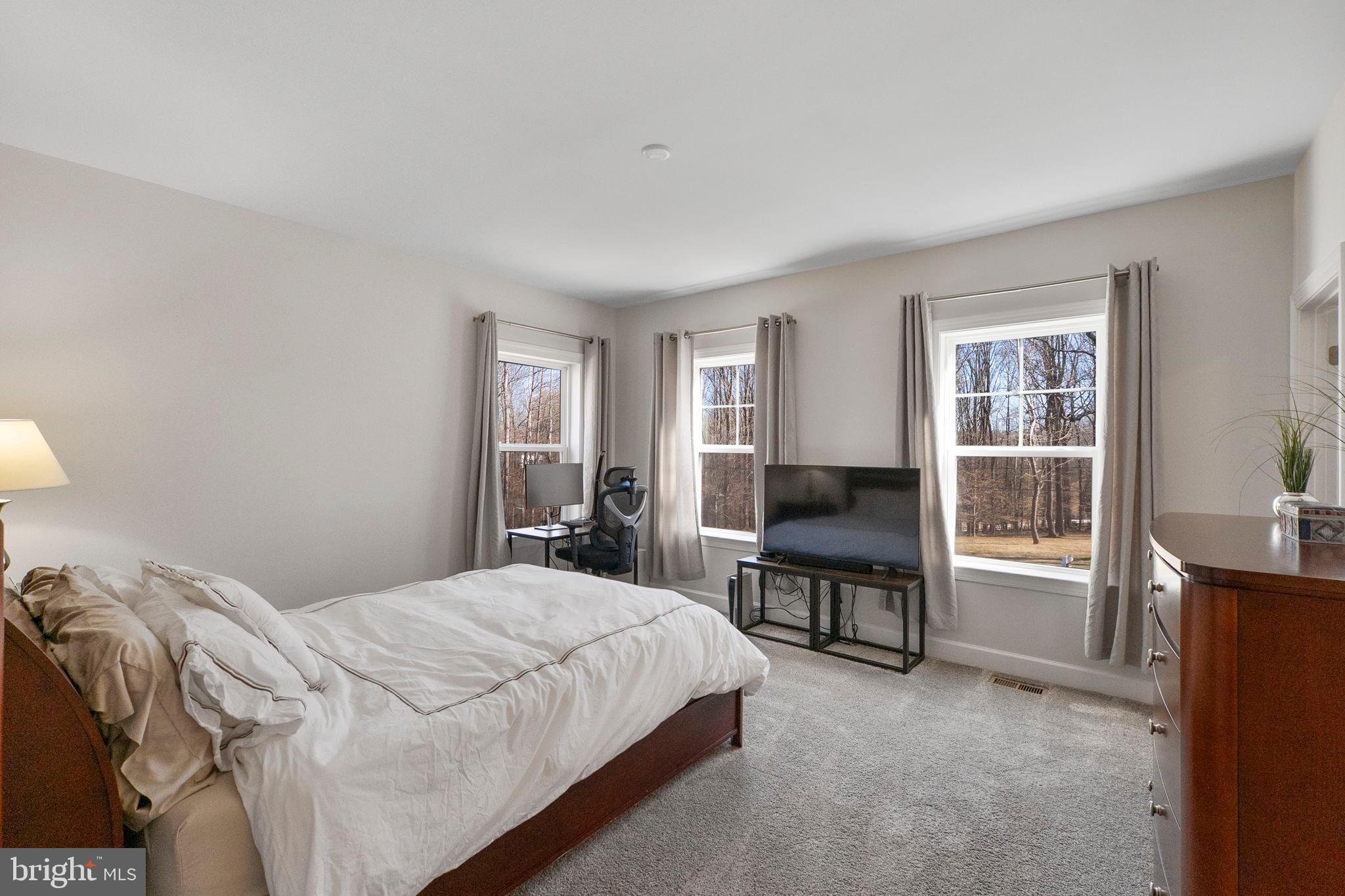 11760 Glen Mill Road Potomac, MD 20854 - Photo 33 of 64 a bedroom with a bed and a desk