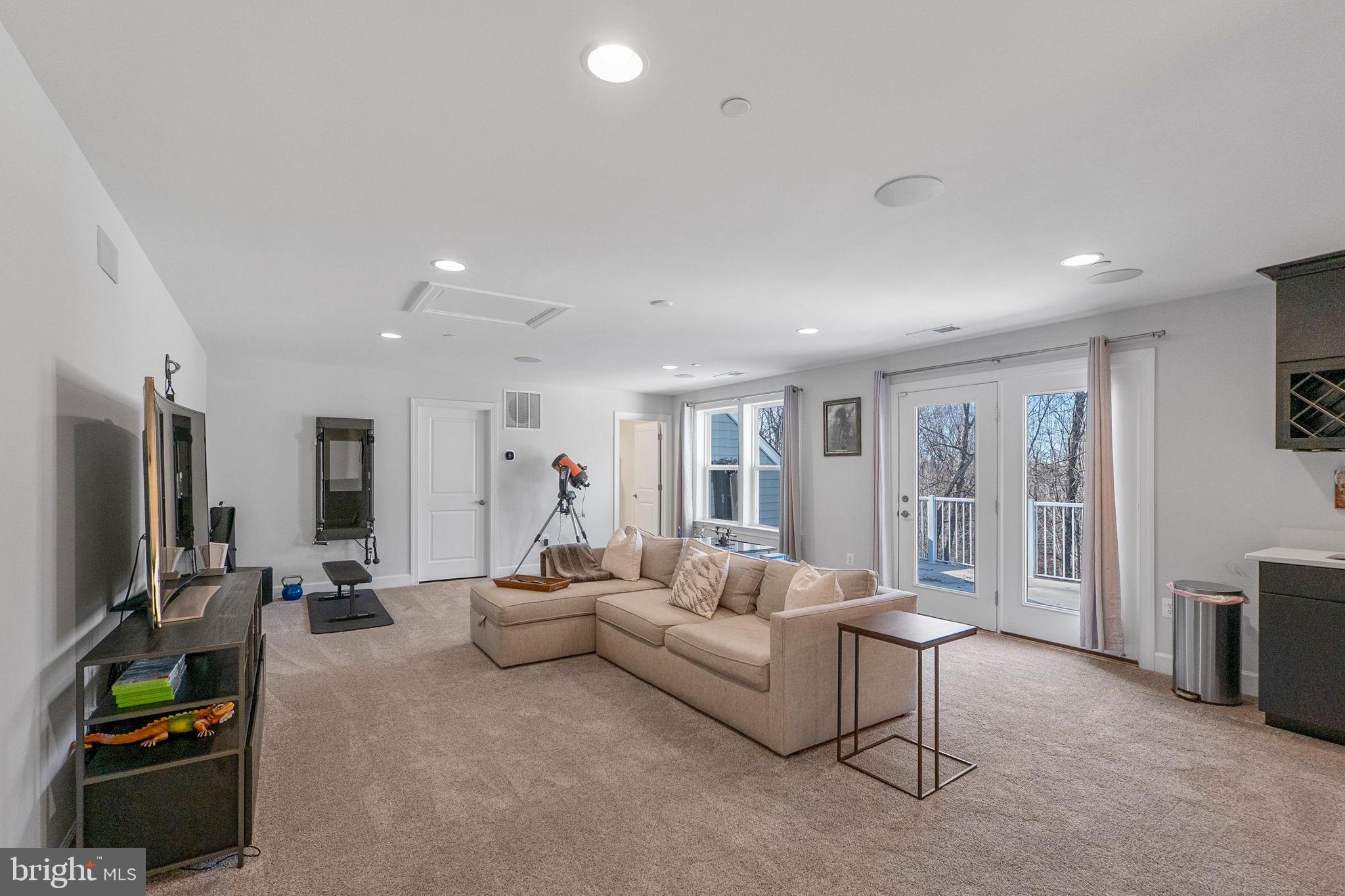 11760 Glen Mill Road Potomac, MD 20854 - Photo 40 of 64 a living room with furniture and a flat screen tv