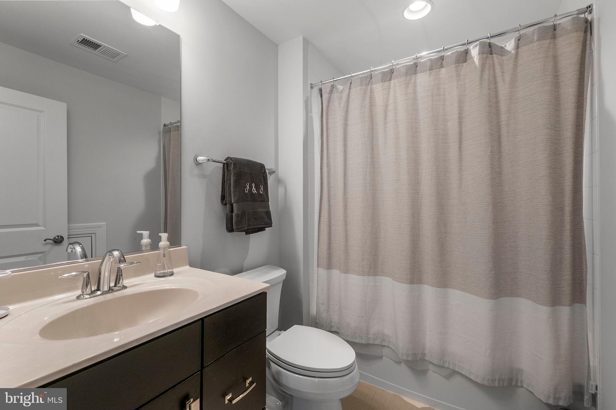 11760 Glen Mill Road Potomac, MD 20854 - Photo 41 of 64 a bathroom with a sink toilet and shower